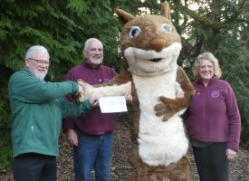 George Hogg presents cheque to Bill and Jan Ferguson (and of course Hazel the Squirrel)